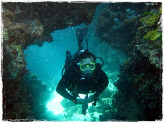 Terry Swimming Through Coral Hole - Great Barrier Reef